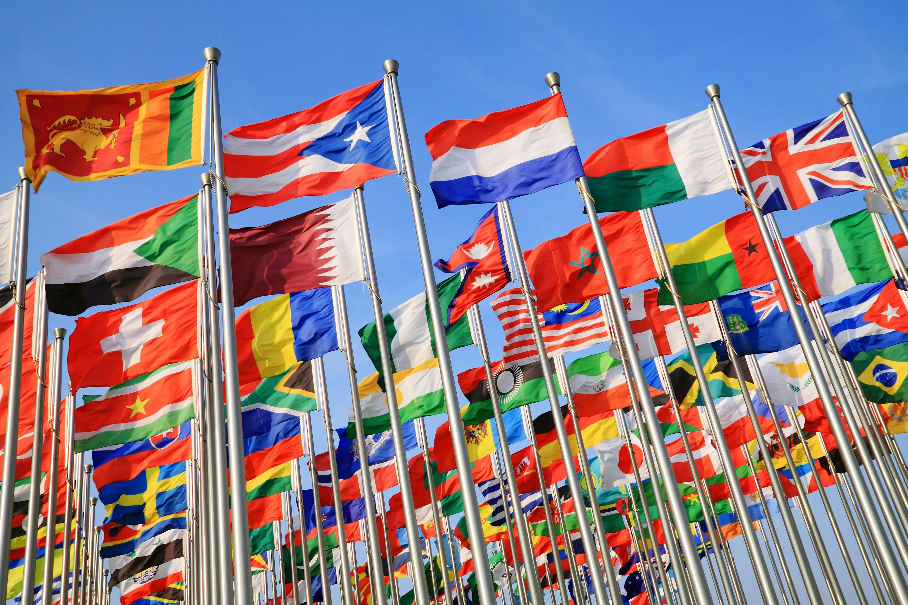 Flags from different nations blowing in the wind